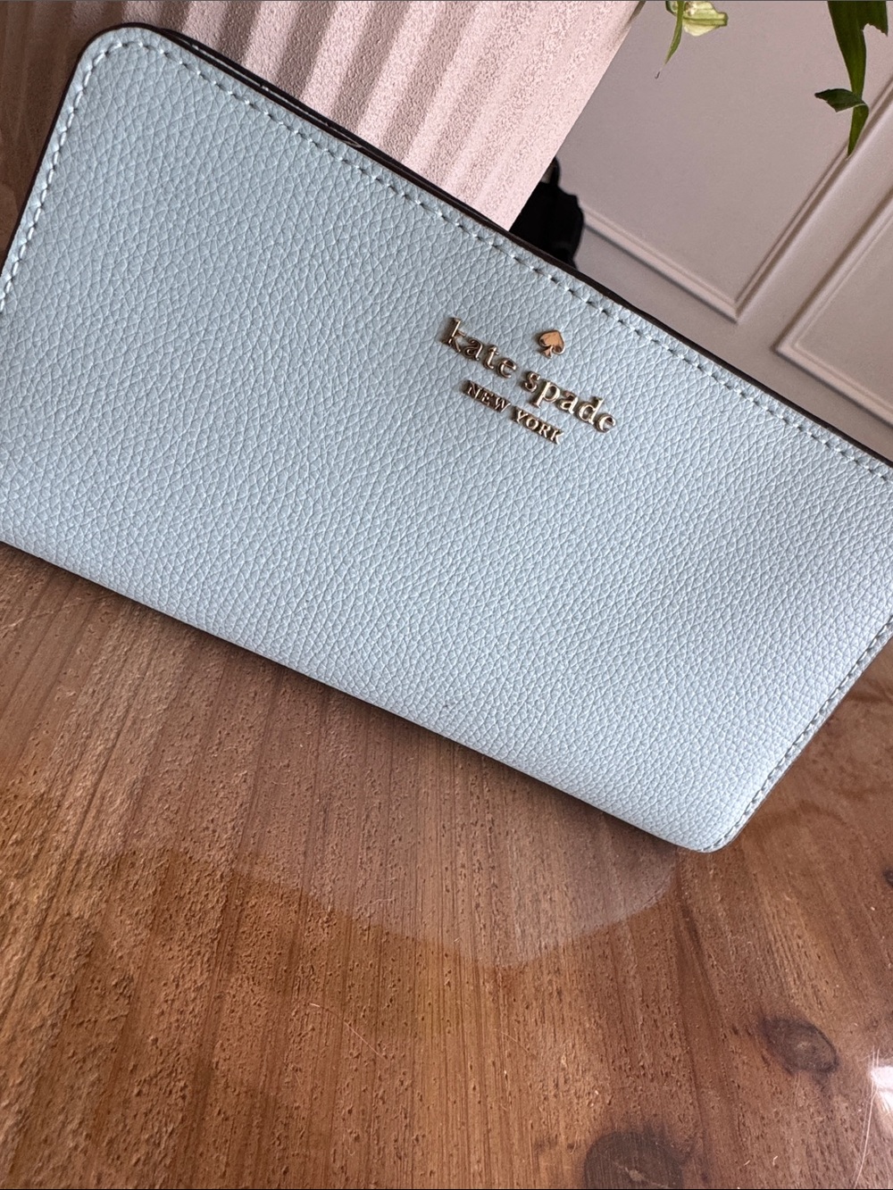kate spade light blue pebbled leather zip-around wallet with gold logo